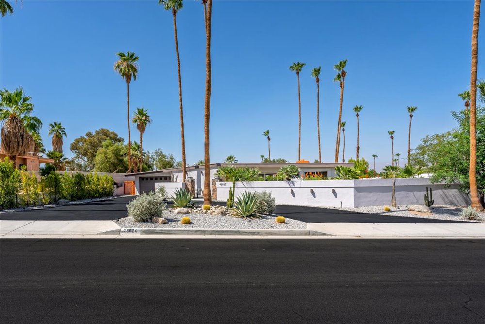 View from across the street of remodeled Palm Desert home with drought-tolerant landscaping and desert plants