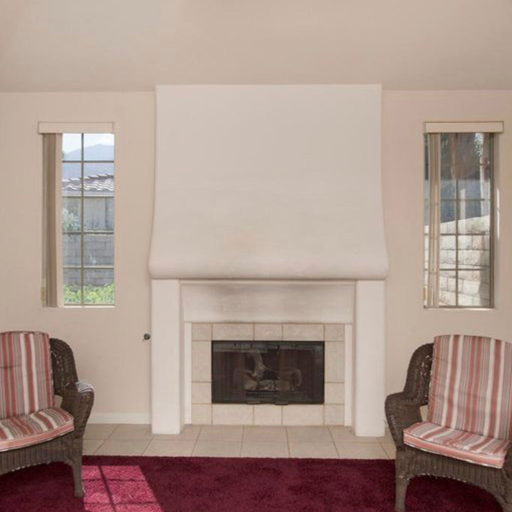 Before photo of original fireplace in Sun Villas guest suite – part of a Palm Springs home renovation