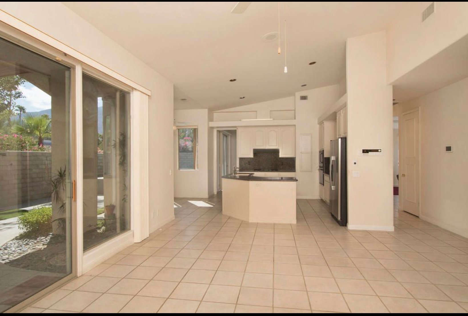 Before photo of outdated kitchen layout at Sun Villas – Palm Springs home renovation